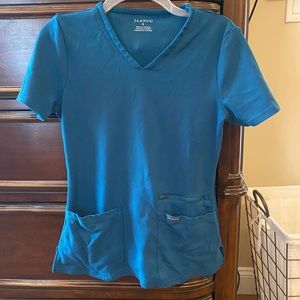 Carribbean Blue Jaanuu scrub top- LIMITED EDITION COLOR